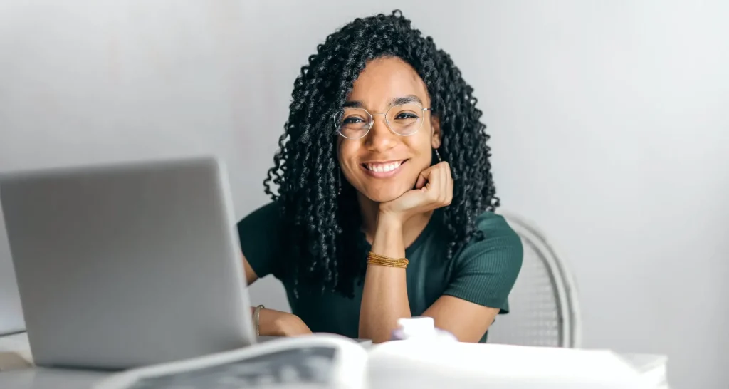 Smiling woman Entrepreneur in front of laptop